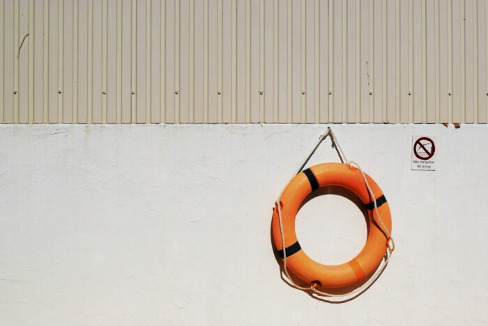 orange life raft symbolising how to support employees through a relationship breakdown